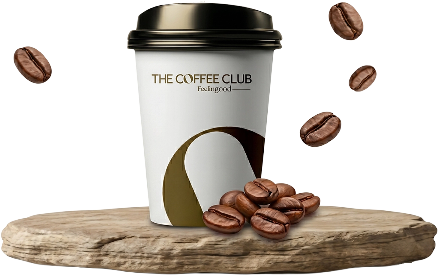 Taş üzerinde The Coffee Club bardağı ve kahve çekirdekleri